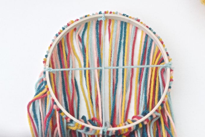 How to Make a Yarn and Embroidery Hoop Chandelier from Dear Handmade Life