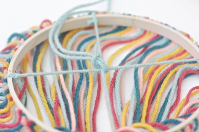 How to Make a Yarn and Embroidery Hoop Chandelier from Dear Handmade Life